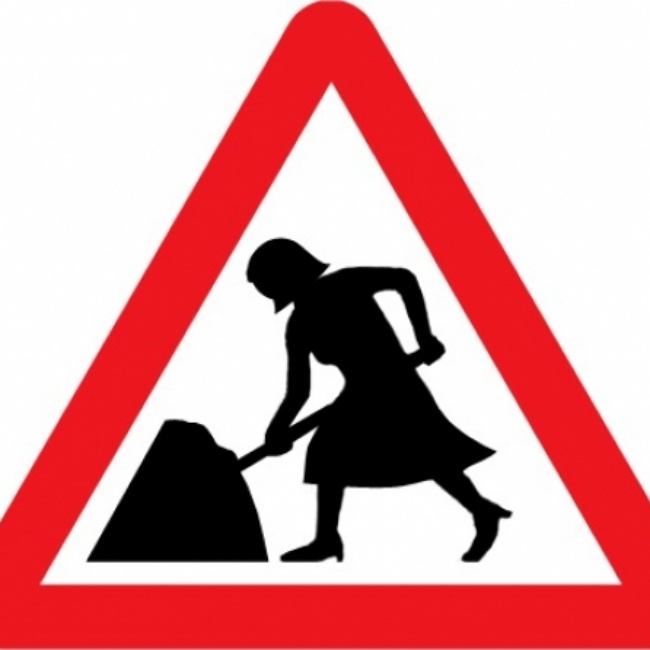 women at work road sign