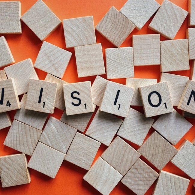 Scrabble letters spelling out 'vision'